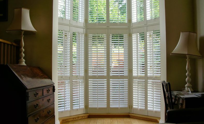 interior shutters in large window in atrium