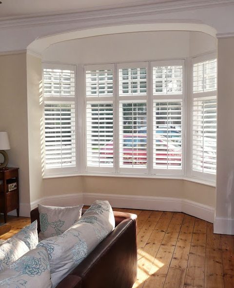 Smart White Bay Window Shutters in Lounge