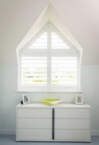 Shaped white window shutter