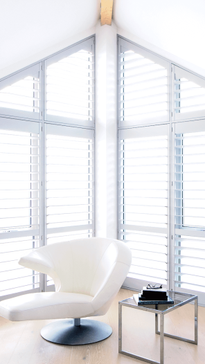slider image of a corner window with shutters